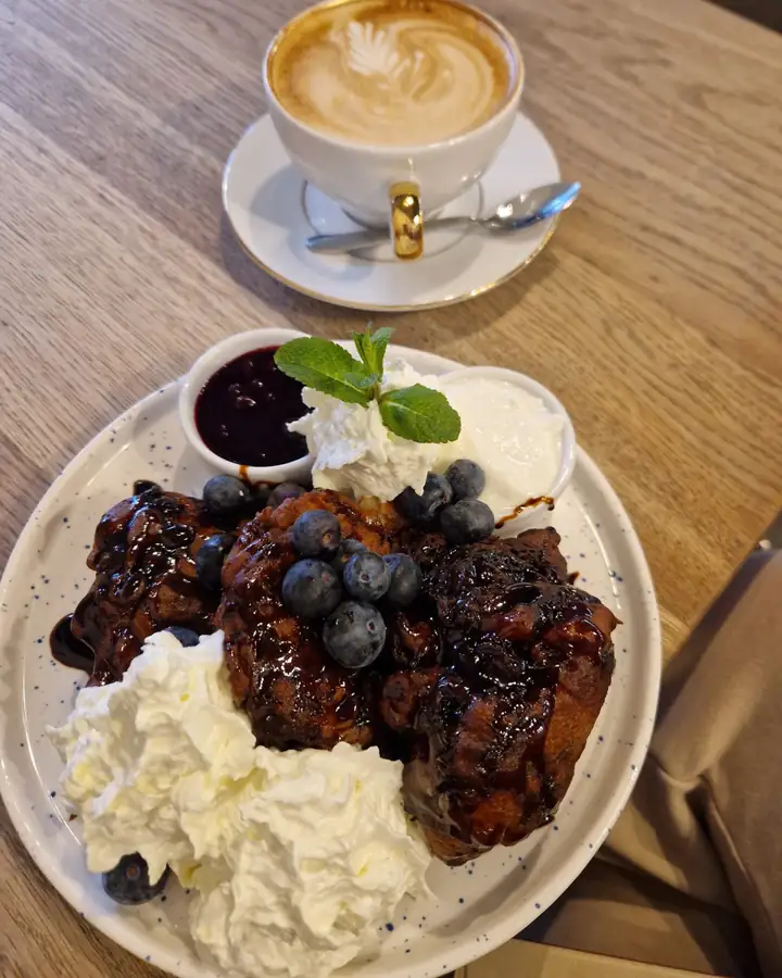 Homemade meringue with berries and whipped cream