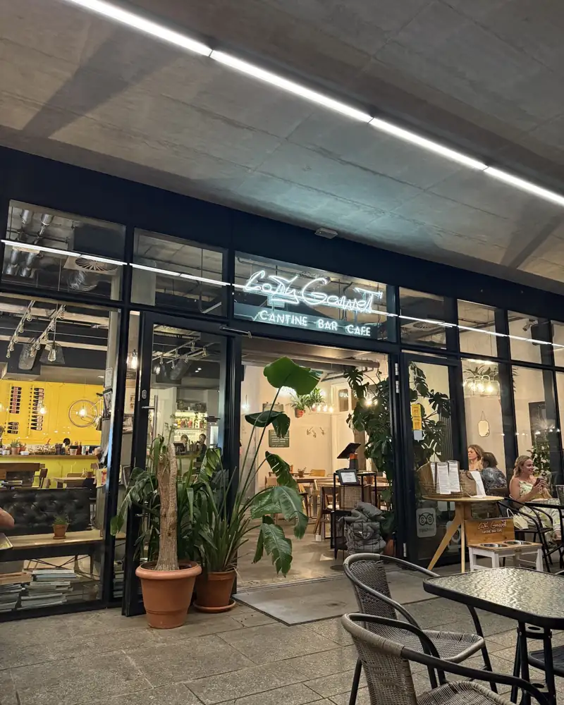 Glass frontage and garden tables among plants